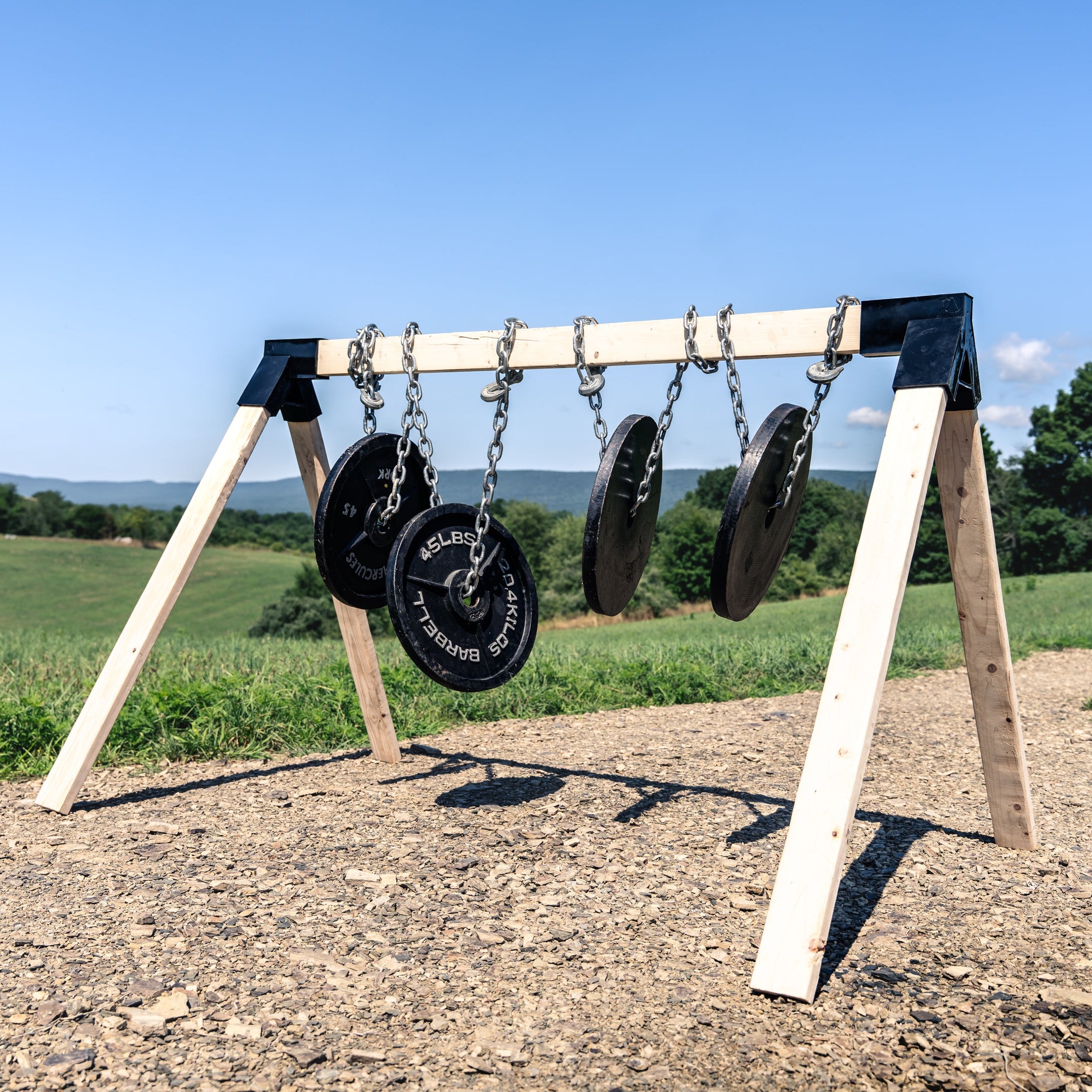 workout plates mounted to target stand to show strength and durability of the shooting target stand
