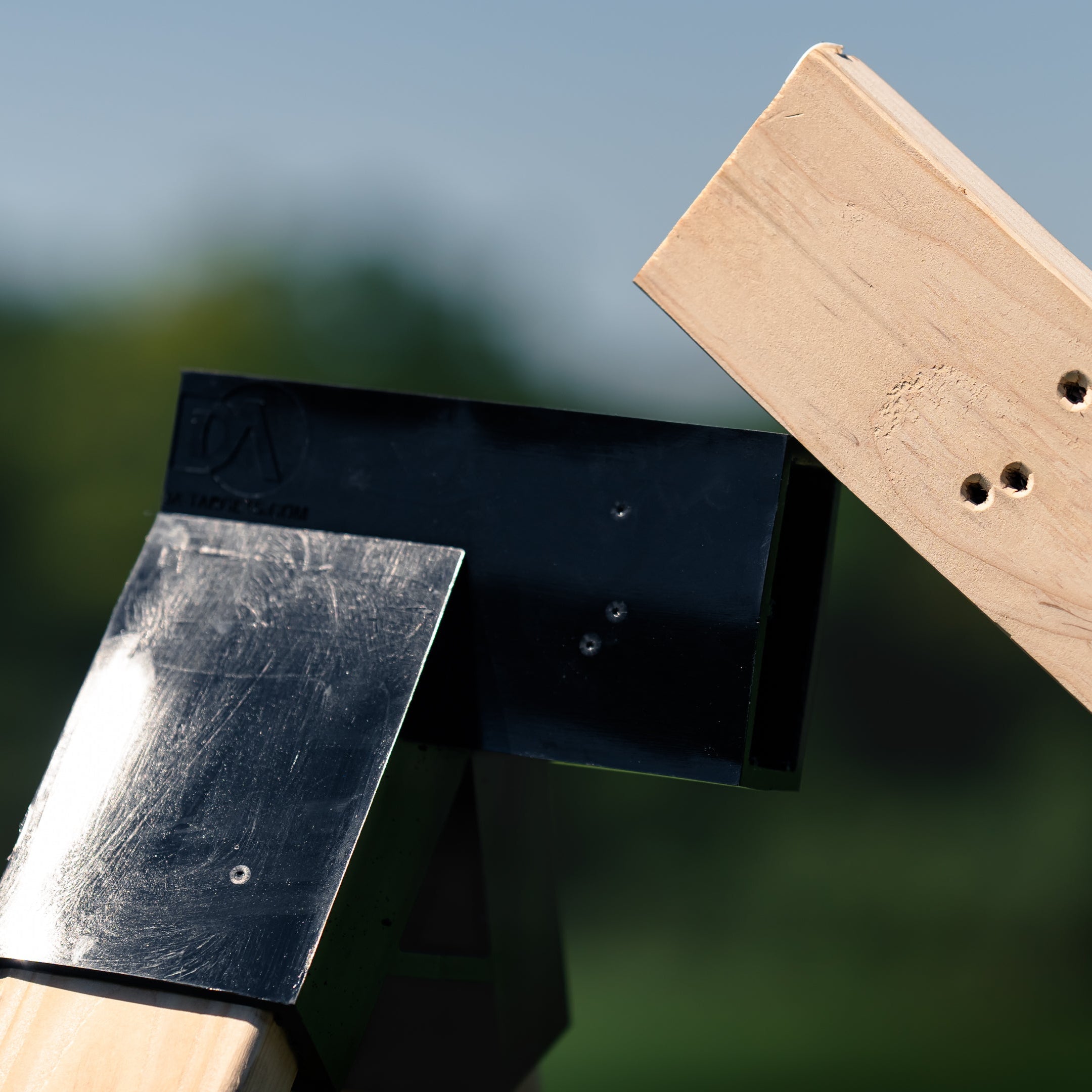 target stand bracket with marks left from bullet hits